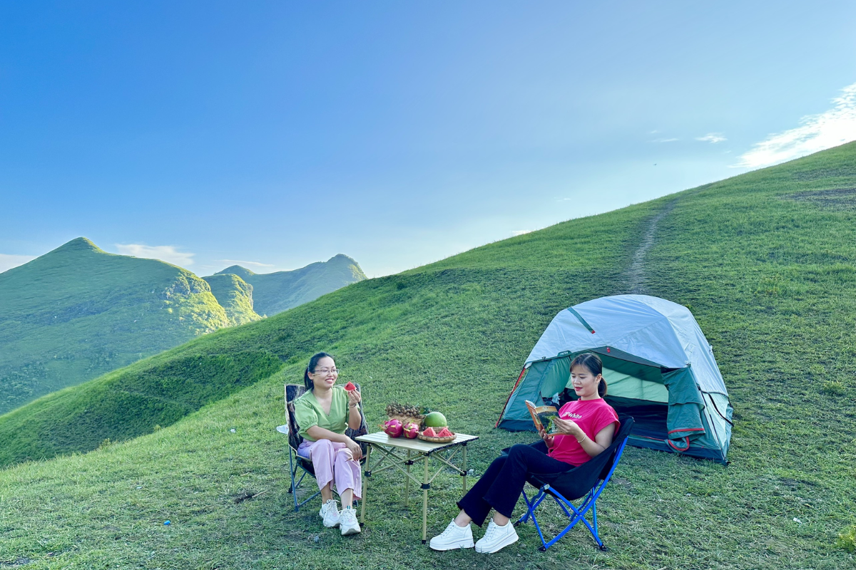 Traveler trekking through the golden hills of Vinh Quy Grass Hill